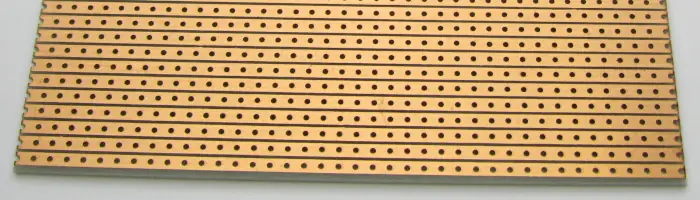 Underside of a Veroboard / stripboard showing the copper tracks